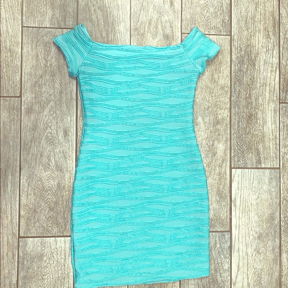 Bright turquoise form fitting dress